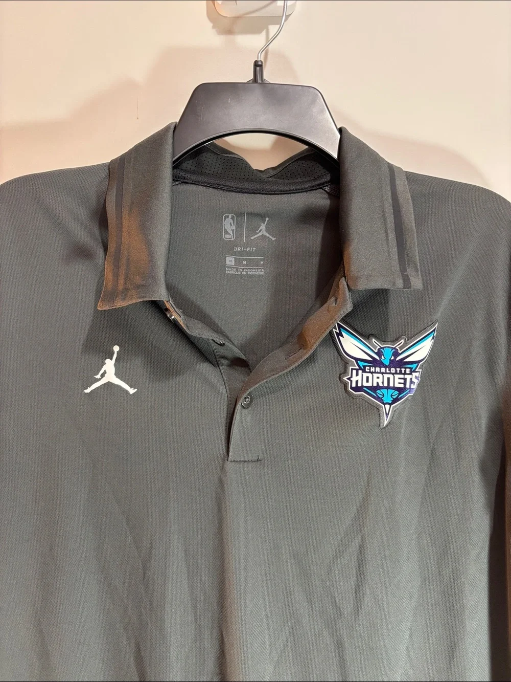 Jordan Black Charlotte Hornets Polo with White Jumpman. 0189